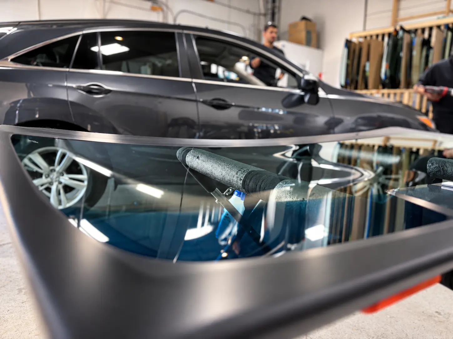 New windshield reflecting workshop lights at QuickGlass